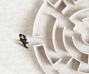 Top view of successful businessman standing near the entrance of labyrinth-1